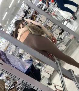Cutie with round ass in beige leggings at the mall