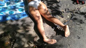 Sexy bikini ass laying out on the rocks up close