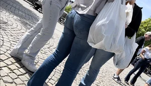 Cute blonde in tight blue jeans