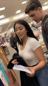Pretty babe in tight jeans showing nipples in book store w bf (Not OC)(Face shot)