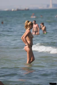 A bunch of sexy beach voyeur babes in bikinis, thongs and topless