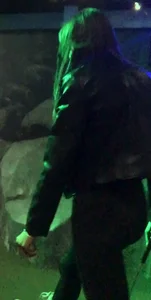 Skinny girl in a leather jacket and leggings playing mini-golf creepshots