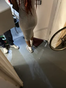 Very cute girl wearing a long tight grey dress kitchen creepshots