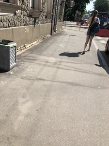 Girl with awesome pale legs in shorts wearing a backpack street creepshots