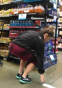 Milf grocery shopping in red leggings with a great ass