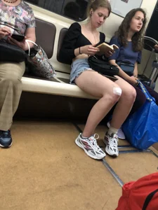 Tall Candid Teen Girl in Denim Shorts and a Top With an Injured Knee Subway and Street Creepshots - Hot and Muscular Long Legs