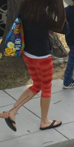 Beautiful brunette teen in orange patterned leggings