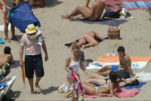 Girls on a nude beach in Sitges, Spain