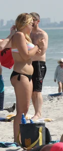 Big boobed thick blonde on the beach in a bikini