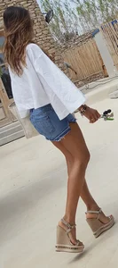 Flat ass leggy girl in denim shorts
