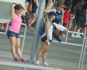 Couple of babes standing around in shorts