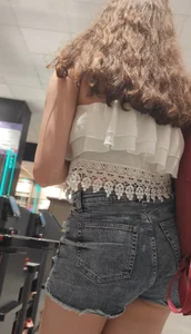 Teen with sexy legs in short jean shorts