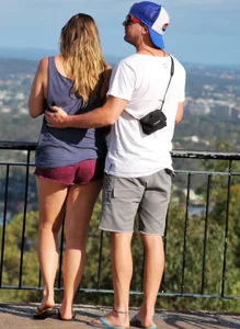 Girl in short maroon shorts with decent booty