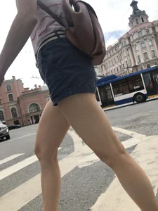 Young Girl in Shorts And Sandals Crossing the Street Gallery