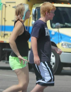 Blonde girl in glasses with a thick booty in green shorts