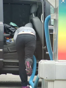 Girls cleaning their cars in jeans and pants
