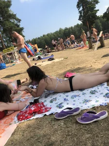 Pale Girl in Swimsuit Lying on a Lake Beach With Her Friends Creepshots Gallery