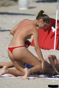 Beach voyeur girls in bikinis, thongs and topless