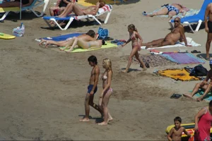 Girls on a nude beach in Sitges, Spain