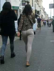 Brunette lady with a nice ass in light grey leggings walking