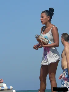 Hot ass topless beach girl with great tits lets her little brother oil up her ass in thong bikini