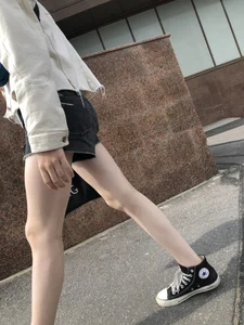 Cute candid teen with pale slim legs in shorts