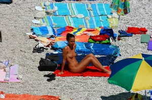 Ula FKK Sexy brunette on a nude beach topless, bottomless and with blue thong