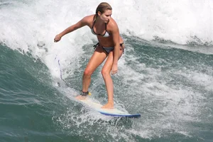 Candid surfer babes on the beach and in bikinis