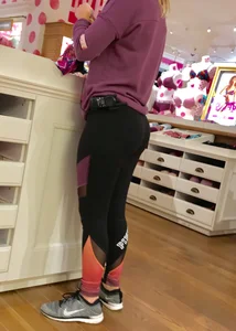Pink employee with a perfectly round ass in leggings