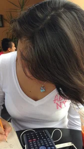 Young Girl Doing Homework - Bra Visible Through T-Shirt