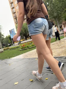 Candid teen wearing denim shorts passing by, nice legs