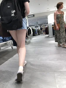 Hot Girl with Pale Skin in a Store Wearing Blue Denim Shorts Creepshots