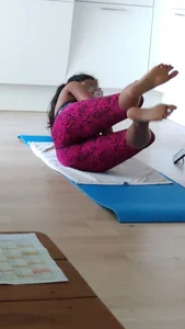 Sexy girlfriend doing yoga at home in leggings