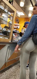 Beautiful brunette shopping in tight grey spandex with a great ass