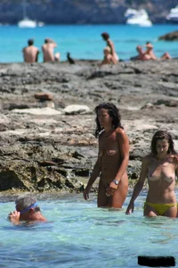 Nude beach ladies in the water showing their tits
