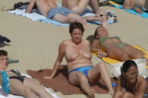 Topless girls on a beach in Barcelona