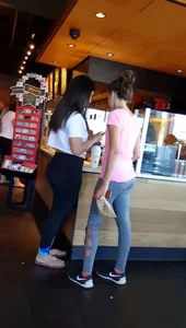 Sexy Latina in leggings and showing some midriff