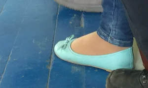 Closeup Photo of a Candid Teen's Foot in a Flat And Pantyhose