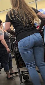 Girl with tattoos in tight jeans