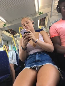 Hot Blonde in Denim Skirt Sitting in the Bus With Her Panties Flashing