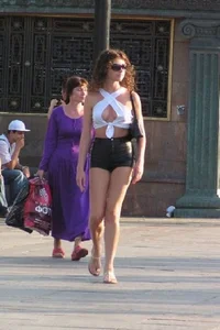 Gorgeous candid chick wearing a top, mini-shorts and sandals street creepshot; long and skinny legs