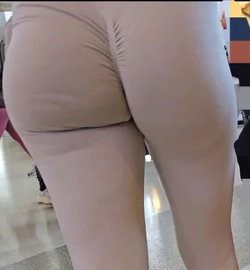 Fit blonde in grey leggings with a Fat Ass