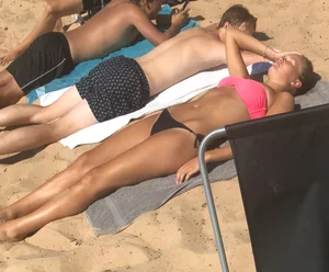 Swedish beach babe in pink and black bikini