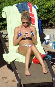 Blonde babe at the pool with sexy body in USA bikini