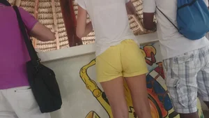 Milf in yellow shorts with vpl and a wedgie