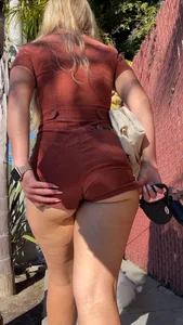 Summer blond in orange showing cheeks