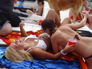 Party girls looking sexy out on boats in bikinis