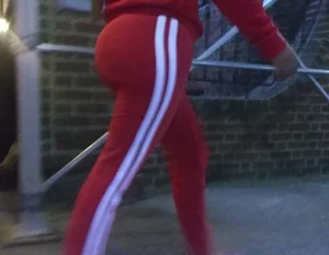 Hot Round Booty in Red Pants Street Closeup