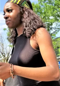 Sexy braless ebony babe in tight skirt with pokies