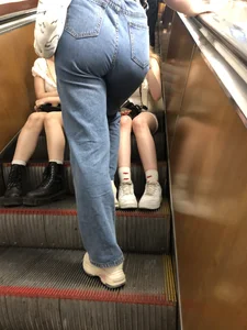 Group of Teens in Short Dresses in a Subway Train and on an Escalator Gallery